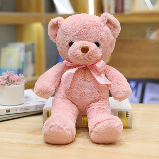 doux ours en peluche rose