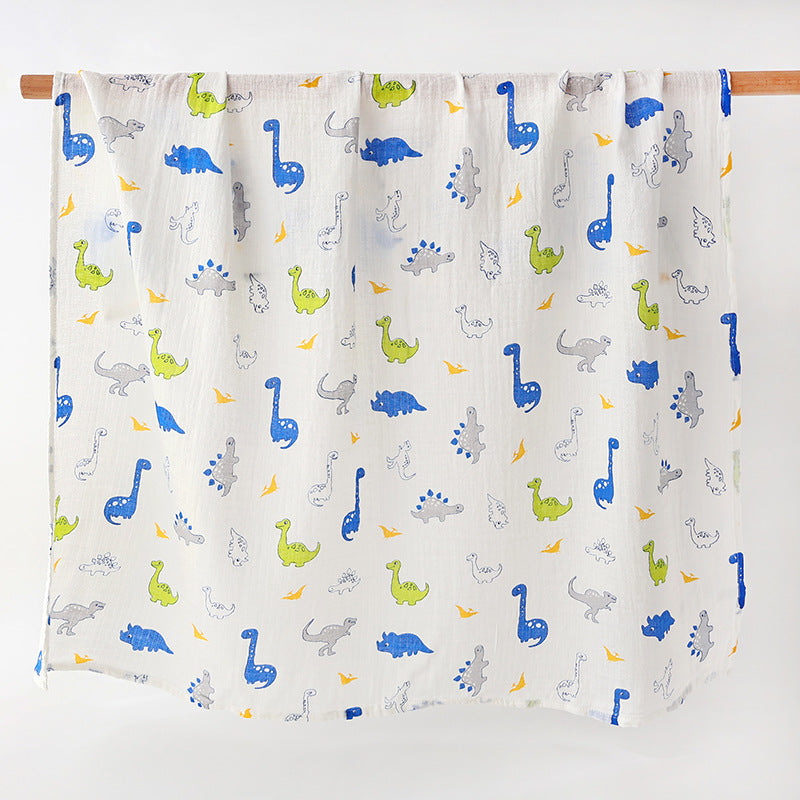 couverture en gaze de coton mousseline légère avec des dinosaures bleu imprimés dessus