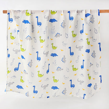 couverture en gaze de coton mousseline légère avec des dinosaures bleu imprimés dessus