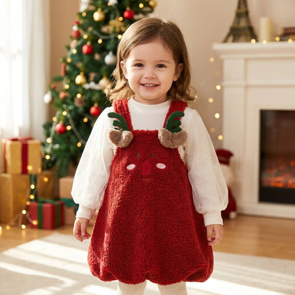 petite fille qui sourit avec une tenue de noël pour bébé fille original pour les fêtes